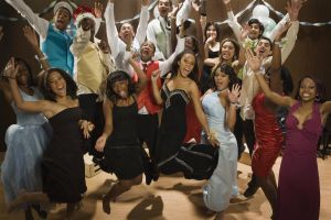 Multi-ethnic teenagers cheering at prom