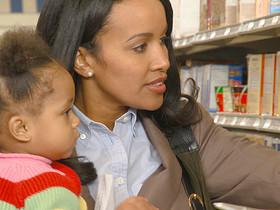 CU, Woman shopping with daughter (12-17 months), Richmond, Virginia, USA