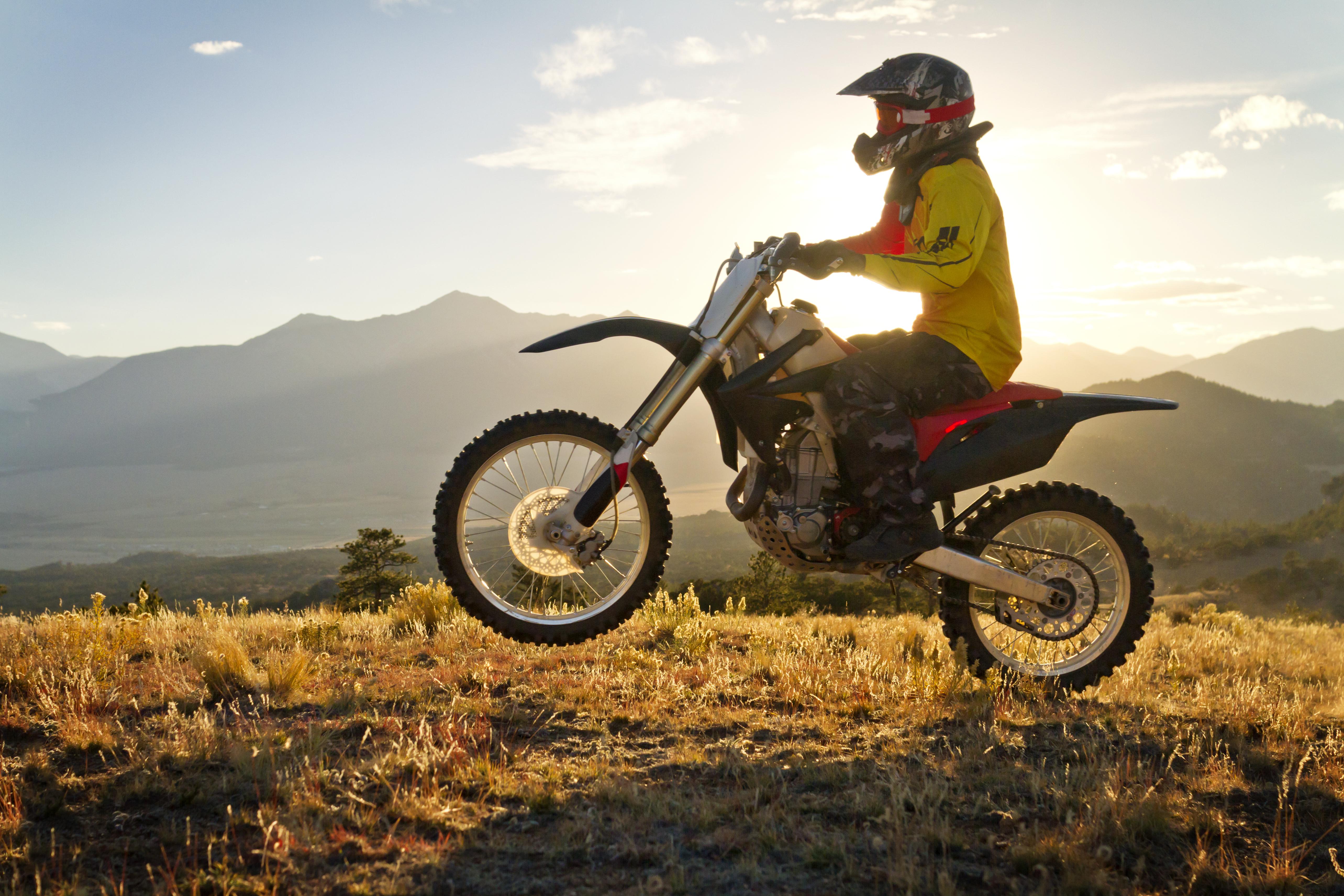 Man Riding Dirt Bike On Mountain