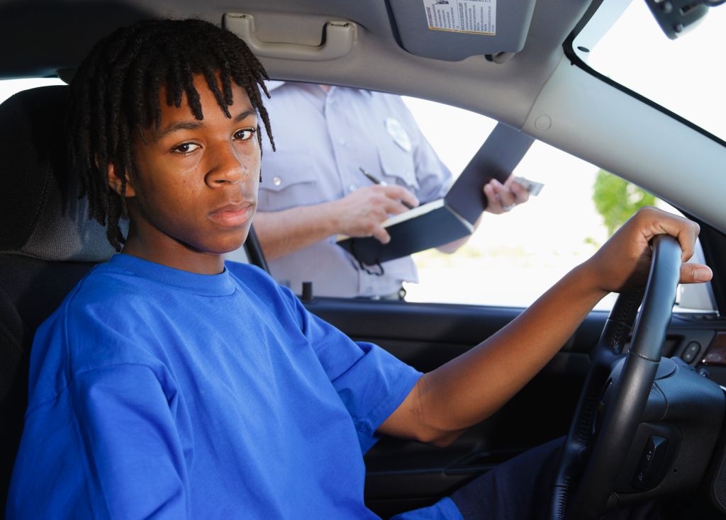 Teenage Boy Receiving a Ticket