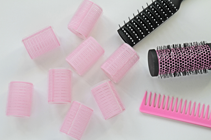Set of professional hairdresser tools on white background