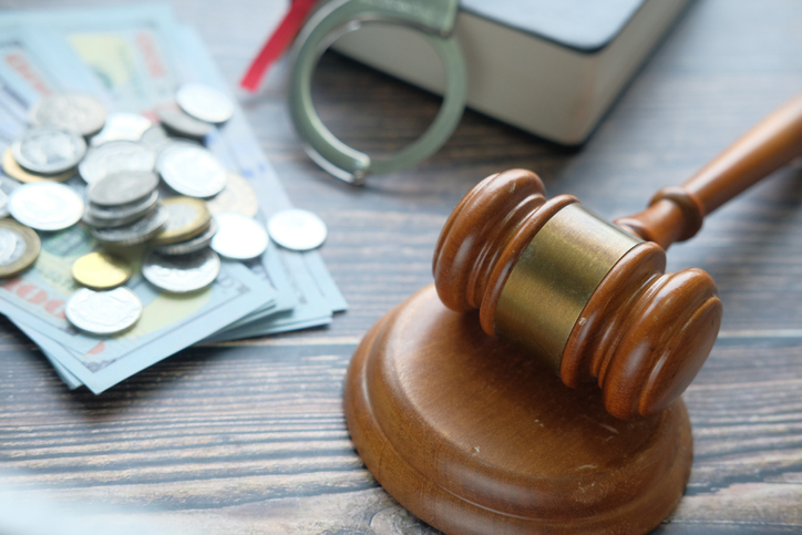 Gavel and coin on table