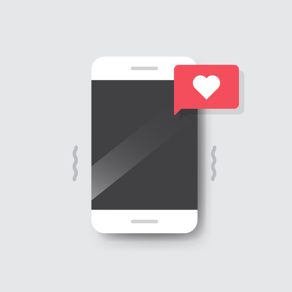 Smartphone with Heart Emoji Speech Bubble Message on Screen.