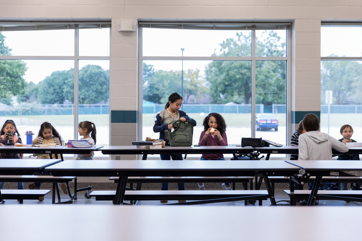 Group of schoolchildren eating lunch