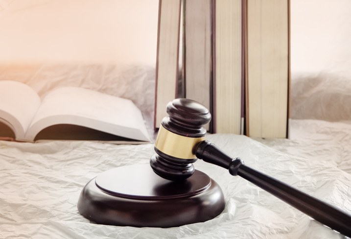 Close-Up Of Gavel On White Table