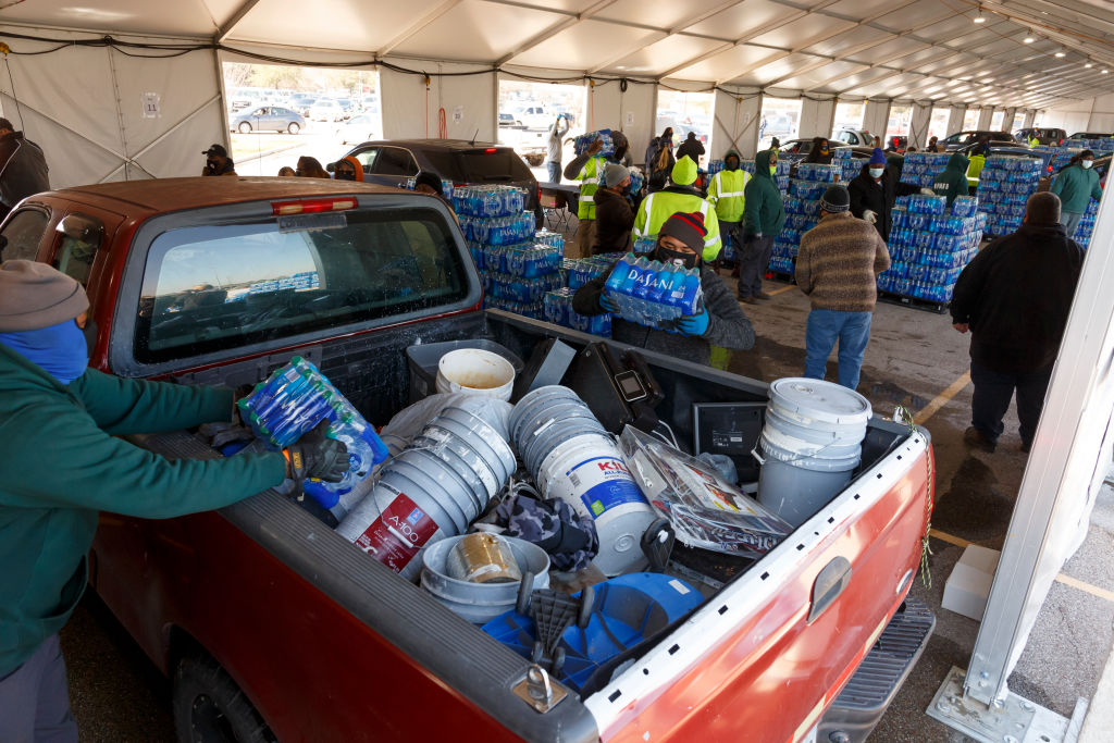 HOUSTON, TX - FEBRUARY, 19: City workers direct long lines of c