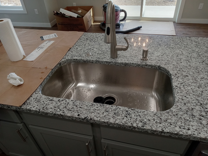 Kitchen remodeling new countertop and faucet