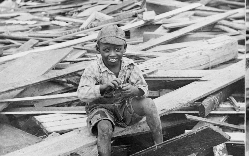 Portrait of Young Boy Sitting on Pile of Debris after Hurricane, Galveston, Texas, USA, Single Image of Stereo Card, 1900